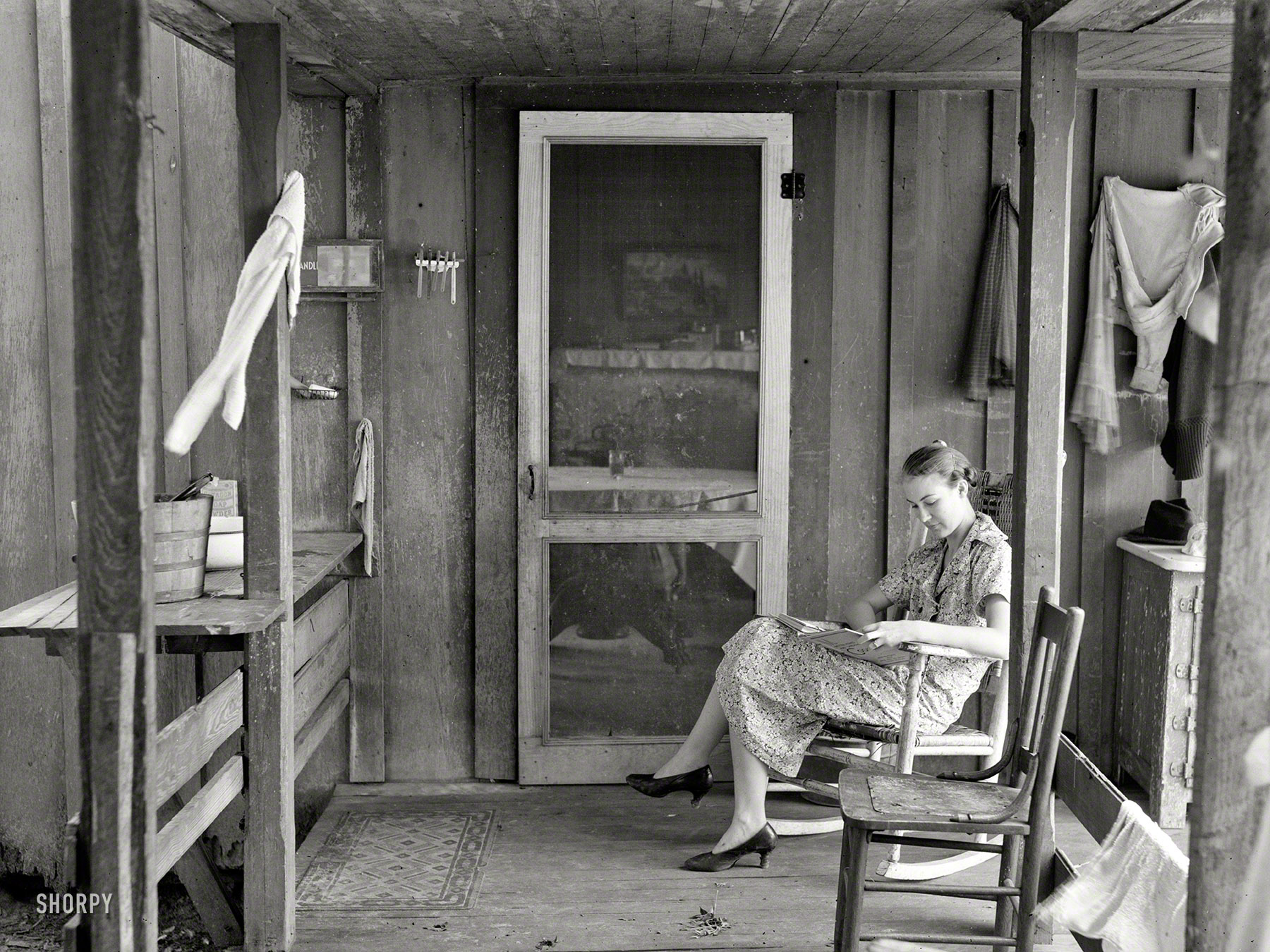 September 1935. "Daughter of resettled farmer, father living temporarily at the jail in Irwinville Farms, Georgia, while new homes are being built." Photo by Arthur Rothstein for the Resettlement Administration. View full size.