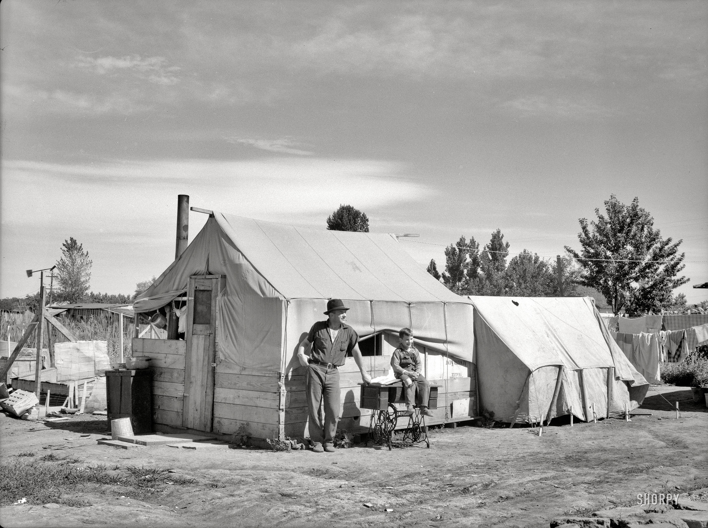 July 1936. "Migratory workers' camp in Yakima, Washington." Displaced farm families from the Dust Bowl states working as laborers in the Northwest's fruit orchards, living in government-run tent camps. Medium-format nitrate negative by Arthur Rothstein for the Resettlement Administration. View full size.