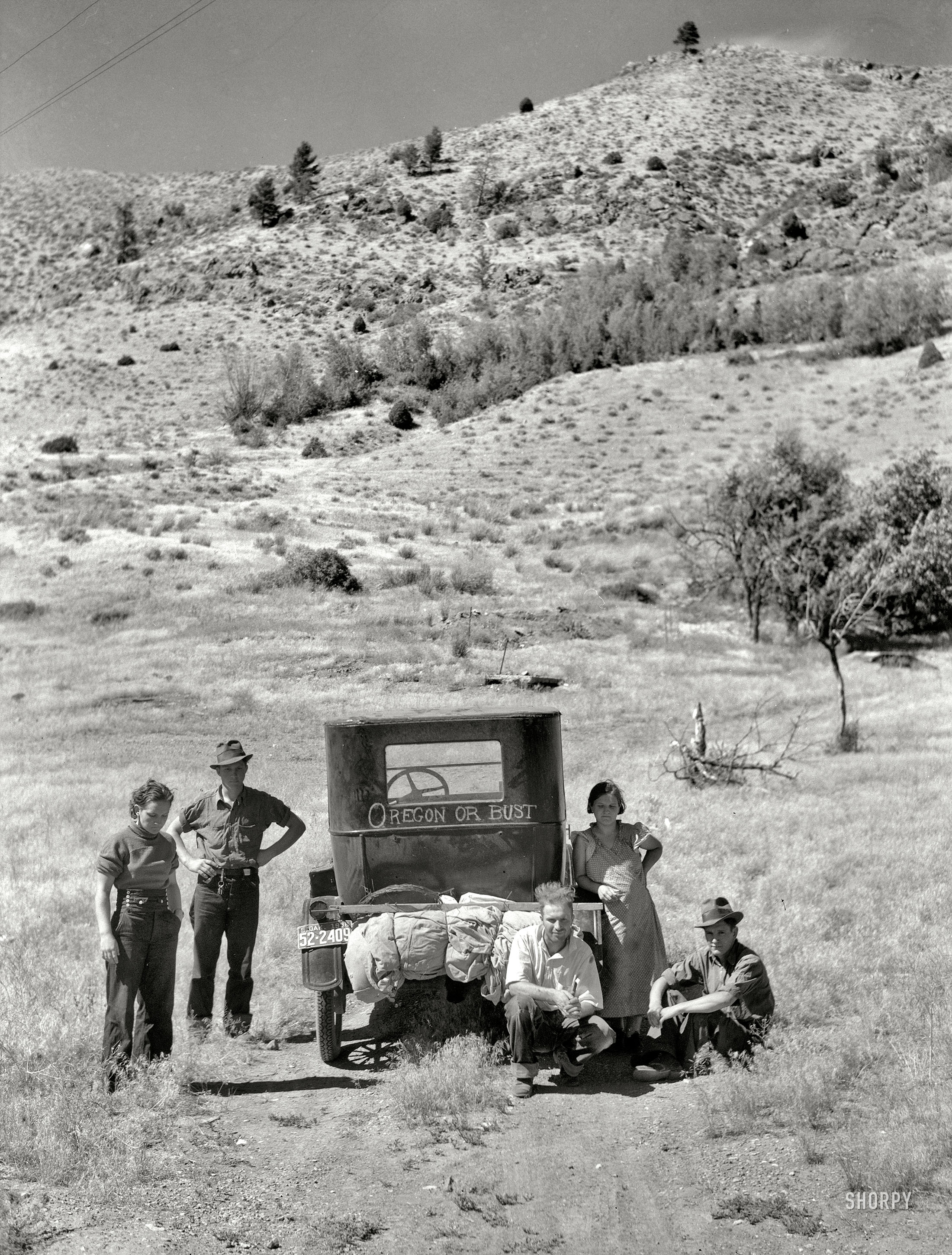 July 1936. "Vernon Evans [interview] and family of Lemmon, South Dakota, near Missoula, Montana. Leaving the grasshopper-ridden and drought-stricken area for a new start in Oregon or Washington. Expects to arrive at Yakima in time for hop picking. Makes about 200 miles a day in Model T Ford. Live in tent." Medium-format nitrate negative by Arthur Rothstein. View full size.