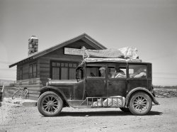 July 1936. Miles City, Montana. "Drought refugees from Glendive, Montana, en route to Washington state." Yet another carload of Dust Bowl migrants. Photo by Arthur Rothstein for the Resettlement Administration. View full size.