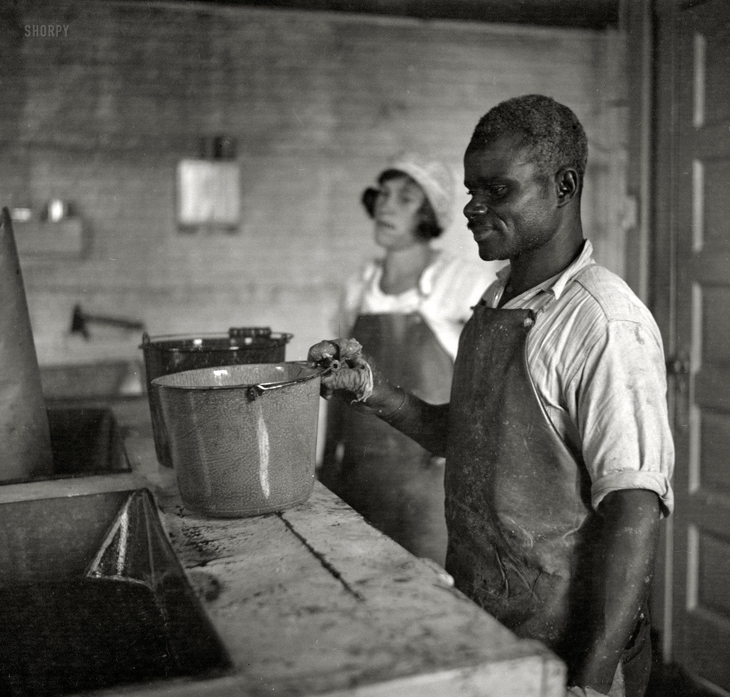 September 1936. "Washing oysters. Rock Point, Maryland." Photo by Arthur Rothstein for the Resettlement Administration. View full size.