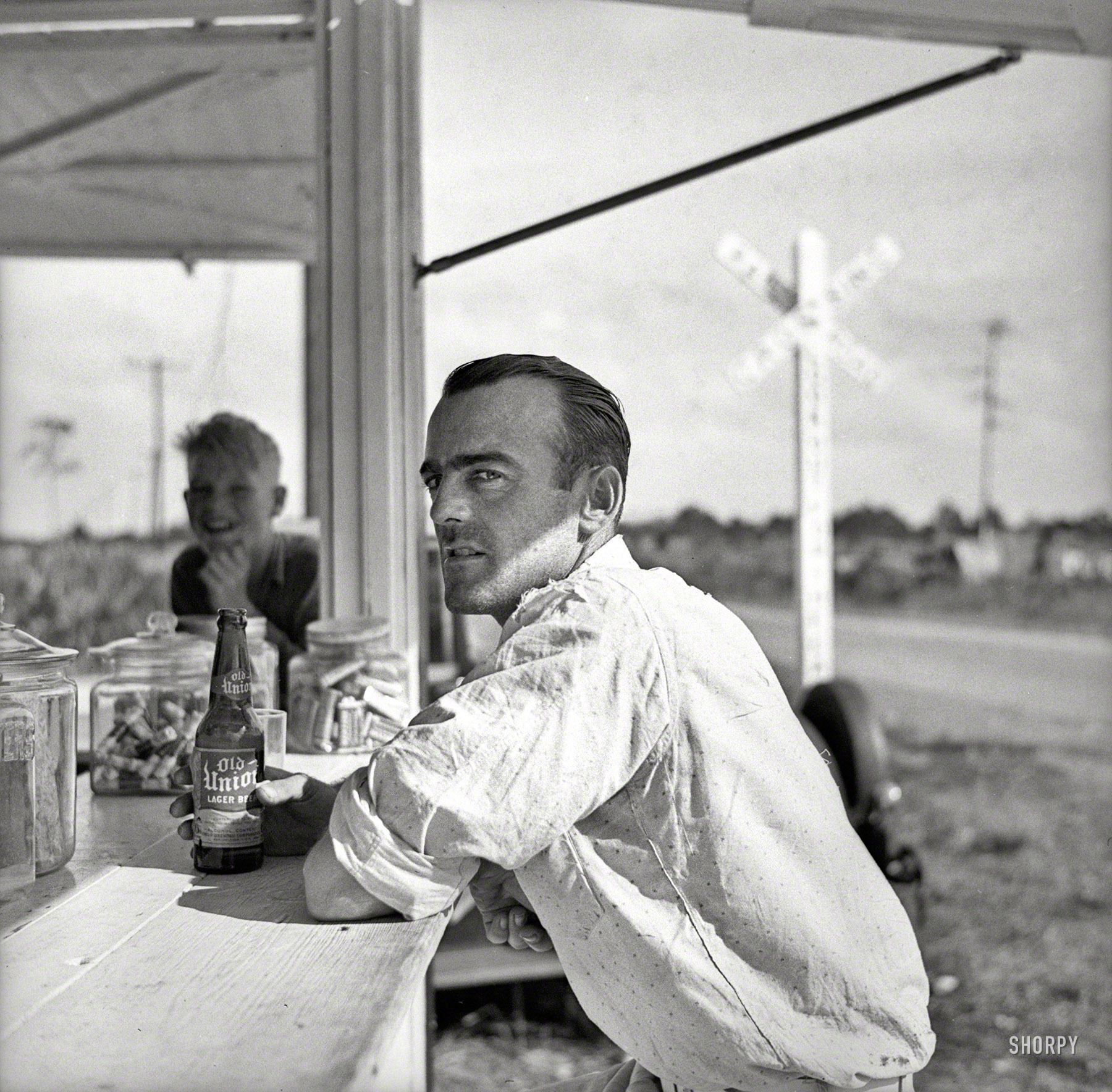 January 1937. "Man who works in the packinghouse at Deerfield, Florida." Our second visit to this pop stand. Photo by Arthur Rothstein for the Resettlement Administration View full size.