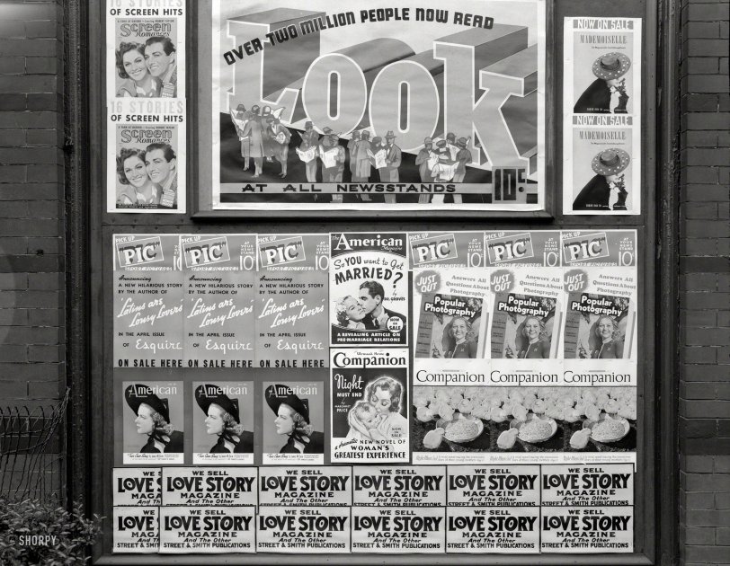 April 1938. "Magazine advertisements. Washington, D.C." Teasers for the latest in titillating periodicals. Photo by John Vachon. View full size.
