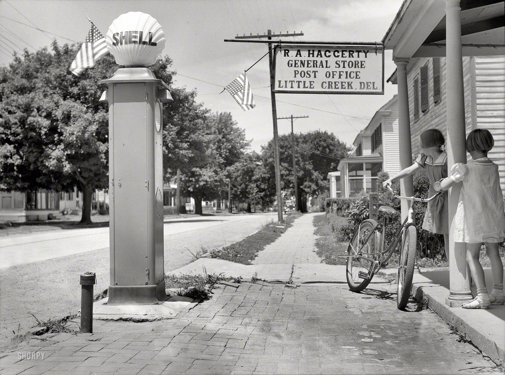 July 1938. "General store and post office in Little Creek, Delaware. A fishing village." Medium format negative by John Vachon. View full size.