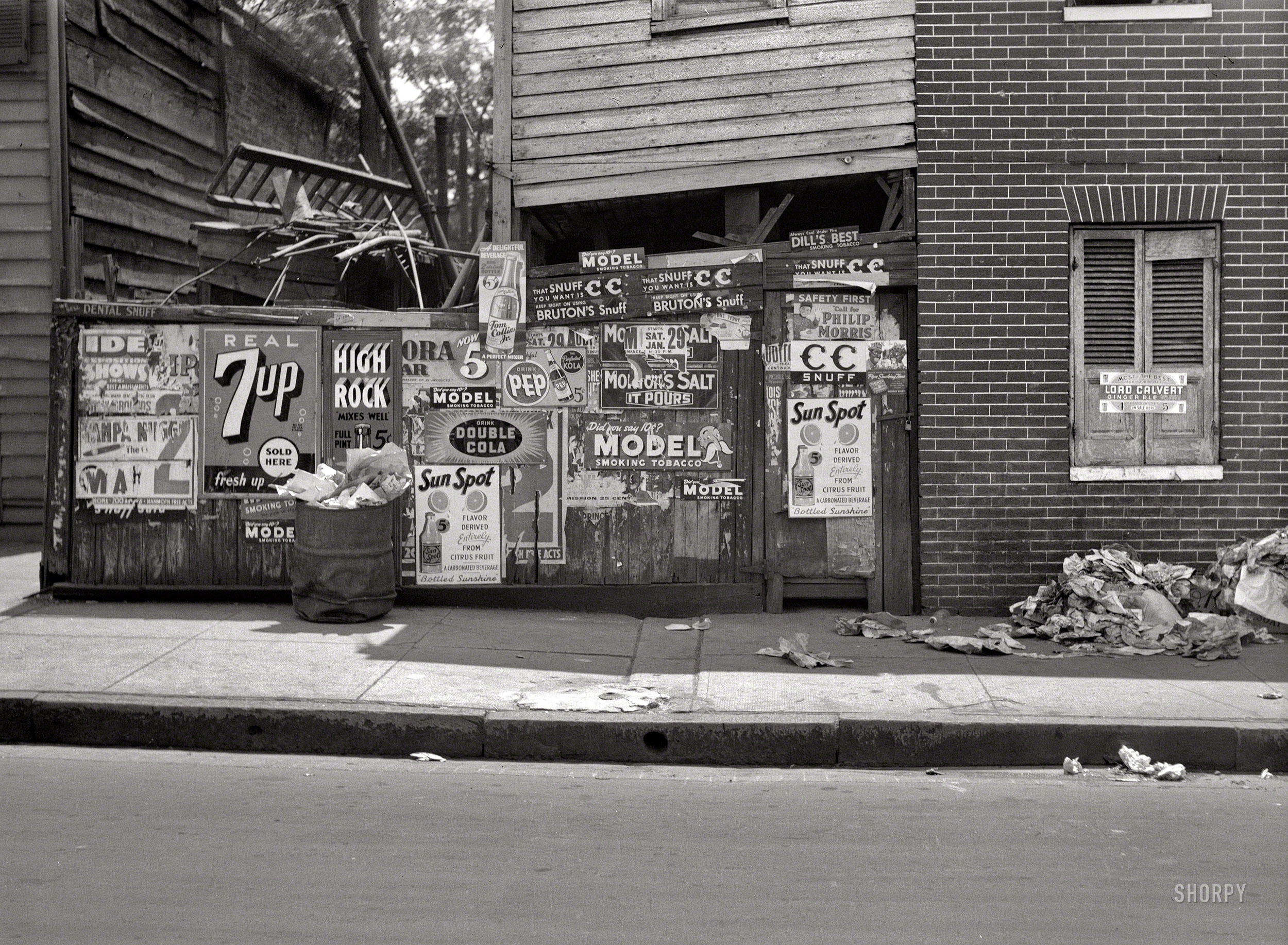 July 1938. "Rear of grocery store in Baltimore." Only hinting at the delights that await within. Medium format nitrate negative by John Vachon. View full size.