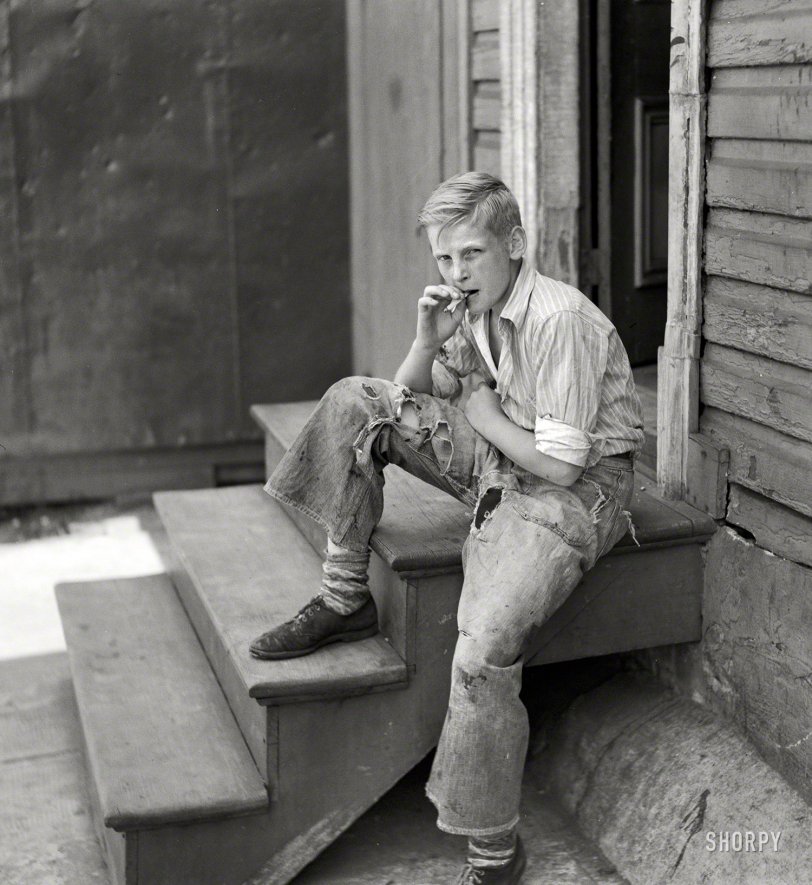July 1938. "Young boy in Baltimore slum area." Potential model for the A&amp;F catalog. Medium-format nitrate negative by John Vachon. View full size.
