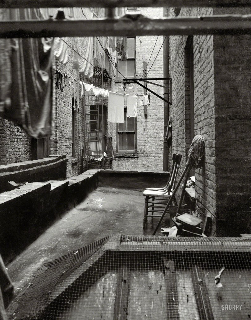 June 1936. "View out of rear window tenement dwelling of Mr. and Mrs. Jacob Solomon, 133 Avenue D, New York City. The Solomon family are all on the accepted list for resettlement at Hightstown, New Jersey." Medium-format nitrate negative by Dorothea Lange for the Resettlement Administration. View full size.
