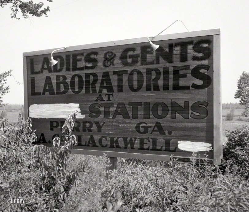 July 1936. "Gas station road sign near Perry, Georgia." Photo by Dorothea Lange, connoisseur of the silly sign and benighted billboard. View full size.
