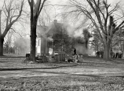November 1936. "Residence on fire in Aledo, Illinois." Now where'd that bucket go? Photo by Russell Lee for the Resettlement Administration. View full size.