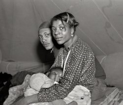 Feb. 1937. "Refugees from the 1937 flood in their tent of the camp in Marianna, Arkansas." Photo by Edwin Locke, Resettlement Administration. View full size.