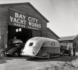 May 1936. Bay City, Michigan. "Deluxe Kauneel auto trailer." Similar to the one seen here. Medium format negative by Taylor. View full size.
PowerThat's a lovely trailer, but I hope the car has the 200hp towing package. 
Funny looking boatThey must be talking about "Land Yachts."
(The Gallery, Cars, Trucks, Buses)