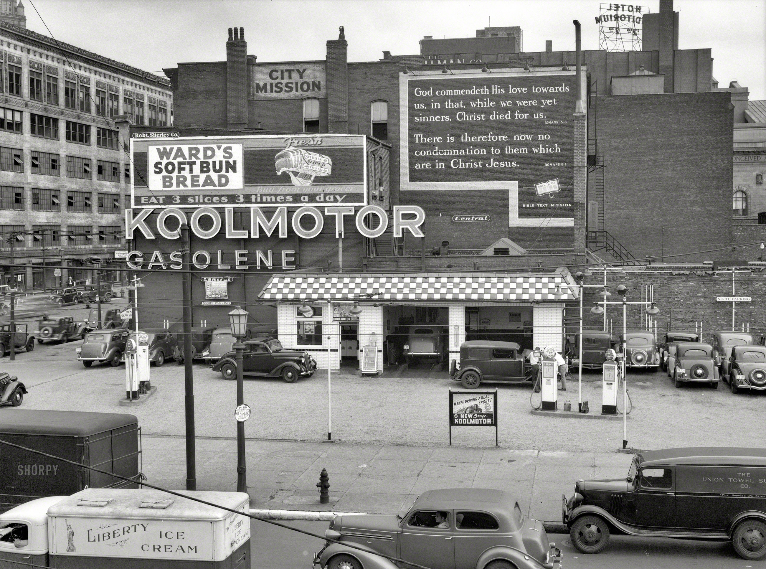 August 1937. "Gas station and gospel mission in Cleveland, Ohio." In addition to Koolmotor "Gasolene," a long-defunct Cities Service brand, we also seem to have at least a couple of the major food groups represented here, as well as two verses from the New Testament. Photo by John Vachon. View full size.