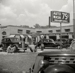 September 1940. Washington, D.C. "Service station on Connecticut Avenue." At the "Auto Laundry," where dark colors evidently get washed together. Medium format nitrate negative by Edwin Rosskam. View full size.