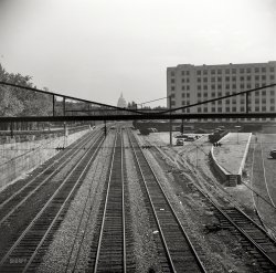 September 1940. Washington, D.C. "Railroad tracks with view of the U.S. Capitol in background." Photo by Edwin Rosskam. View full size.