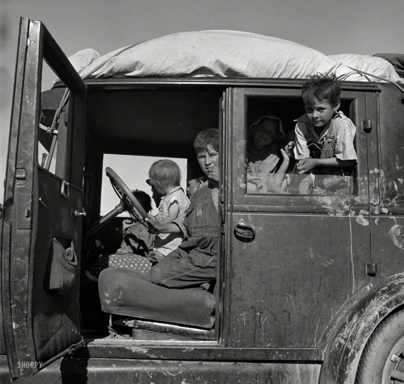 March 1937. "Migrant children from Oklahoma on California highway." Photo by Dorothea Lange for the Farm Security Administration. View full size.
