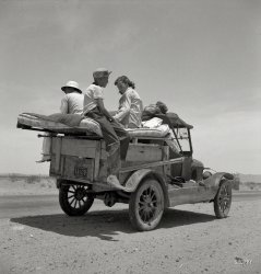 May 1937. "Migratory family traveling across the desert in search of work in cotton at Roswell, New Mexico. U.S. Route 70, Arizona." Where are the cupholders on this rig? Dorothea Lange / Resettlement Administration photo. View full size.