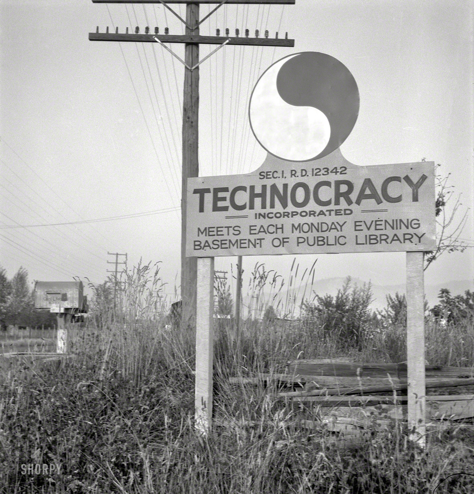August 1939. Josephine County, Oregon. "New sign, erected seven years after Howard Scott talked of a survey of North America and formation of 'energy units,' which had widespread vogue in the early years of Depression." Another of Dorothea Lange's quirky-sign photos. View full size.