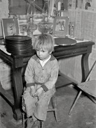 January 1939. "Boy whose father is on relief. Family living in shanty at city dump. Herrin, Illinois." Seen earlier here and here. Medium format negative by Arthur Rothstein for the Resettlement Administration. View full size.