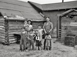 June 1937. "Art Simplot and family in front of their house near Black River Falls, Wisconsin." The prolific Russell Lee shoots the prolific Simplots. View full size.