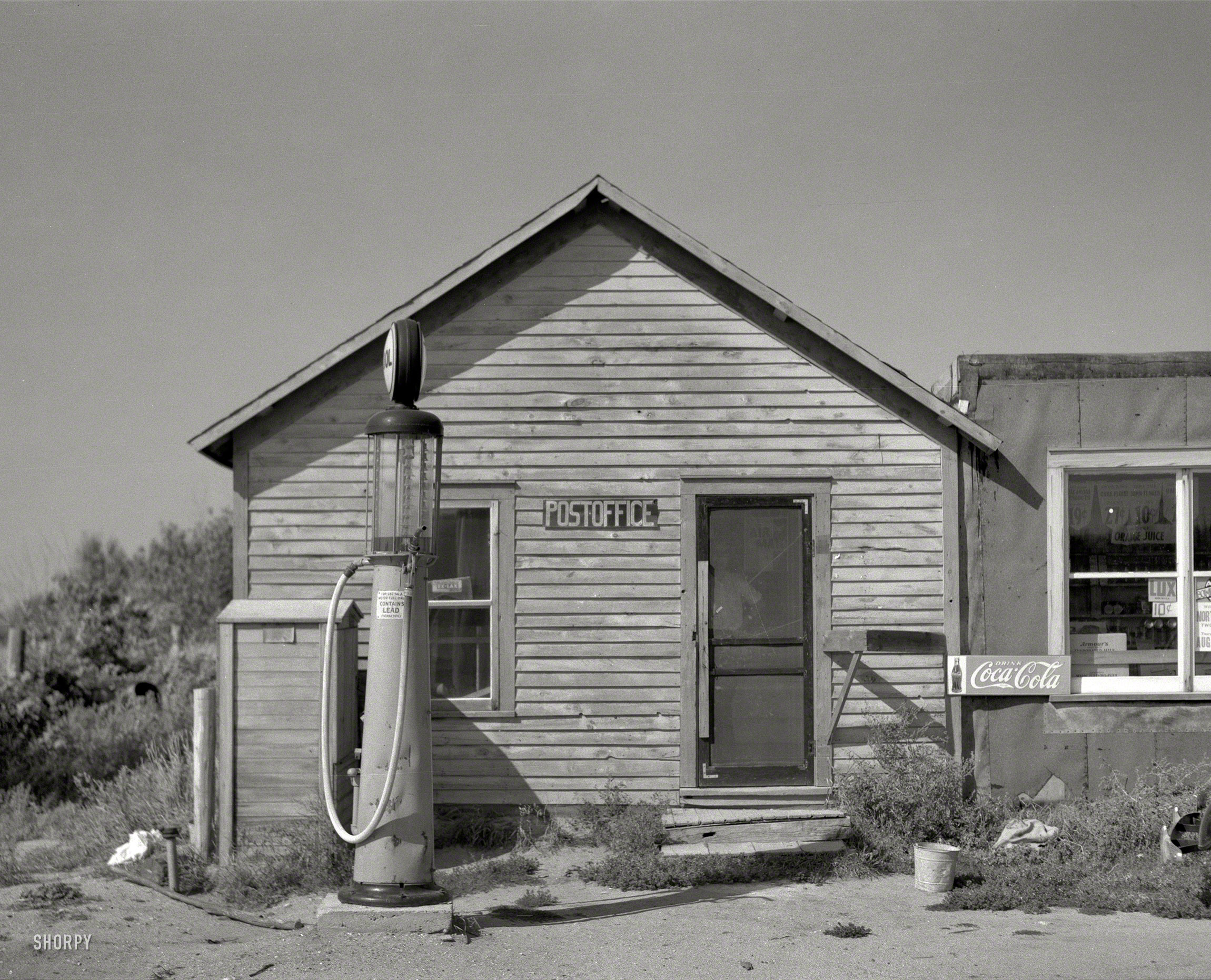 August 1937. "Post office in Gemmell, Minnesota." One-stop shopping for a variety of needs. Photo by Russell Lee, Resettlement Administration. View full size.