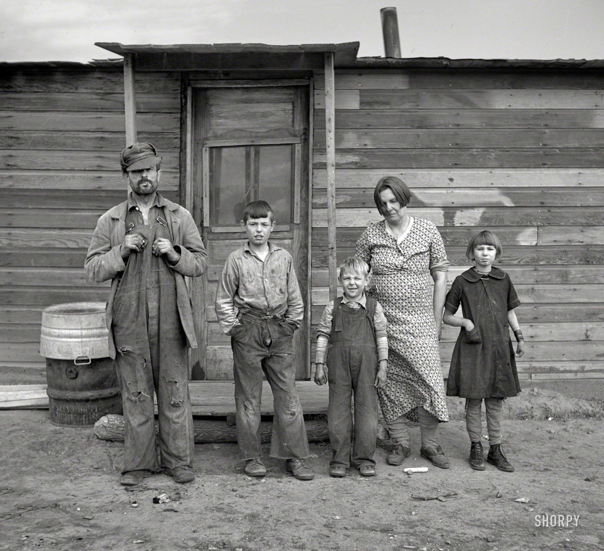 October 1937. "Family of Joe Kramer, farmer near Williston, North Dakota." Photo by Russell Lee for the Resettlement Administration. View full size.
