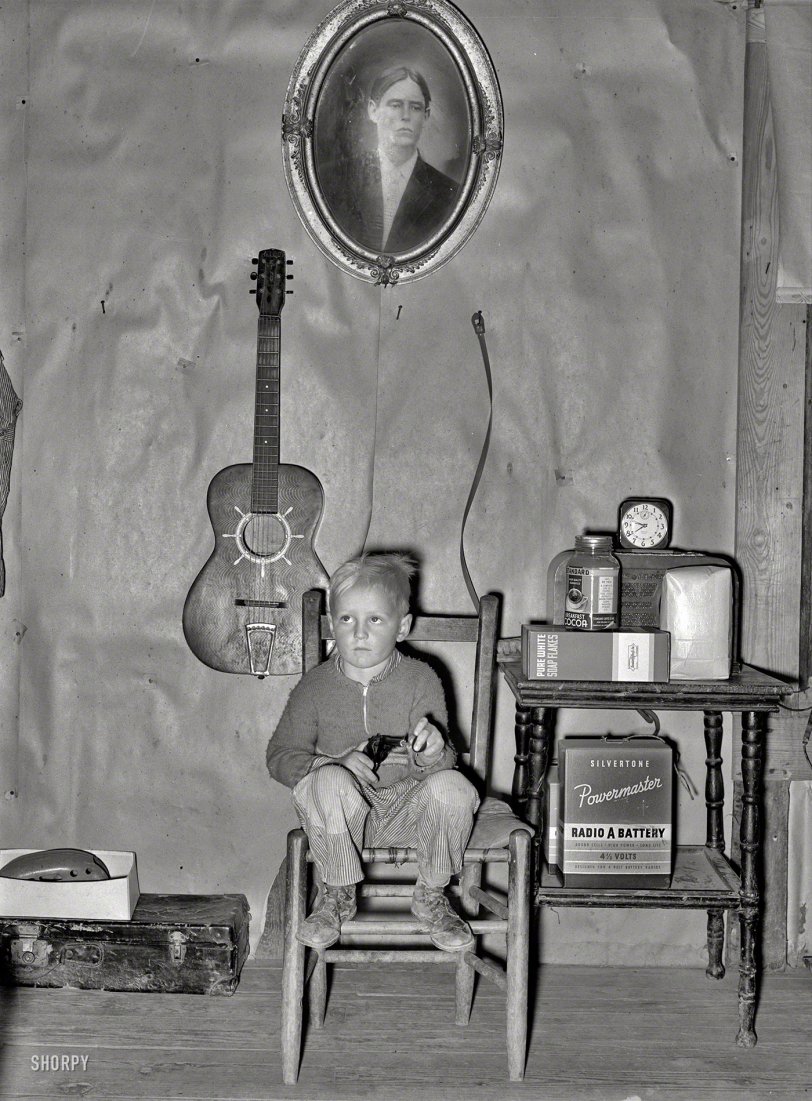January 1939. "Sunflower Plantation. Son of tenant farmer in corner of living room. Pace, Mississippi." Note Sonny's suction-cup ammo. Large-format nitrate negative by Russell Lee for the Resettlement Administration. View full size.
