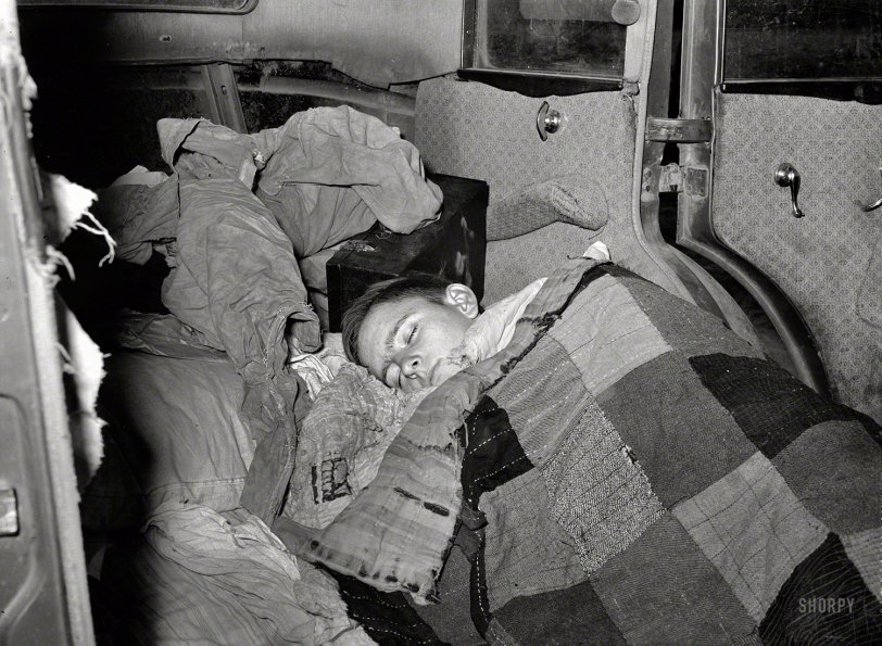 February 1939. "White migrant boy asleep in car. He came with his father from Houston to Edinburg, Texas." Good night, John-Boy. Medium-format nitrate negative by Russell Lee for the Resettlement Administration. View full size.
