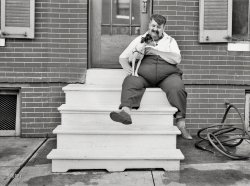 July 1938. "Man who lives in row house. Baltimore, Maryland." Walkies, anyone? Photo by John Vachon for the Resettlement Administration. View full size.