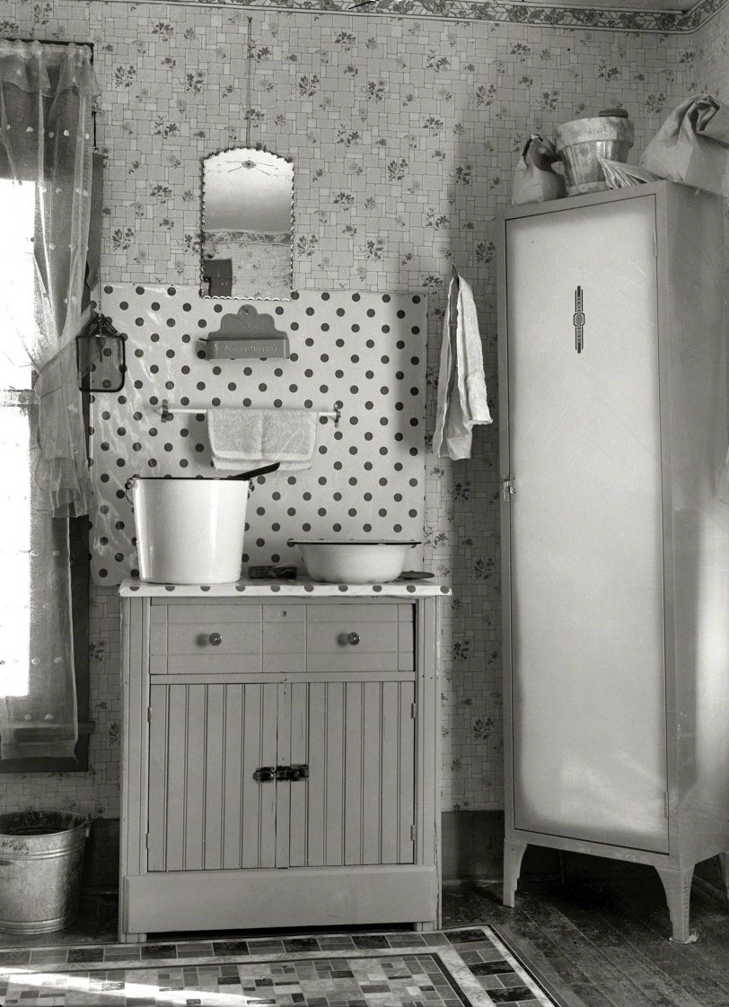 December 1936. "Washstand in house occupied by married hired hand and his wife. Harry Madsen farm near Dickens, Iowa. Three hundred sixty acres, owner-operated." View full size. Medium format nitrate negative by Russell Lee.