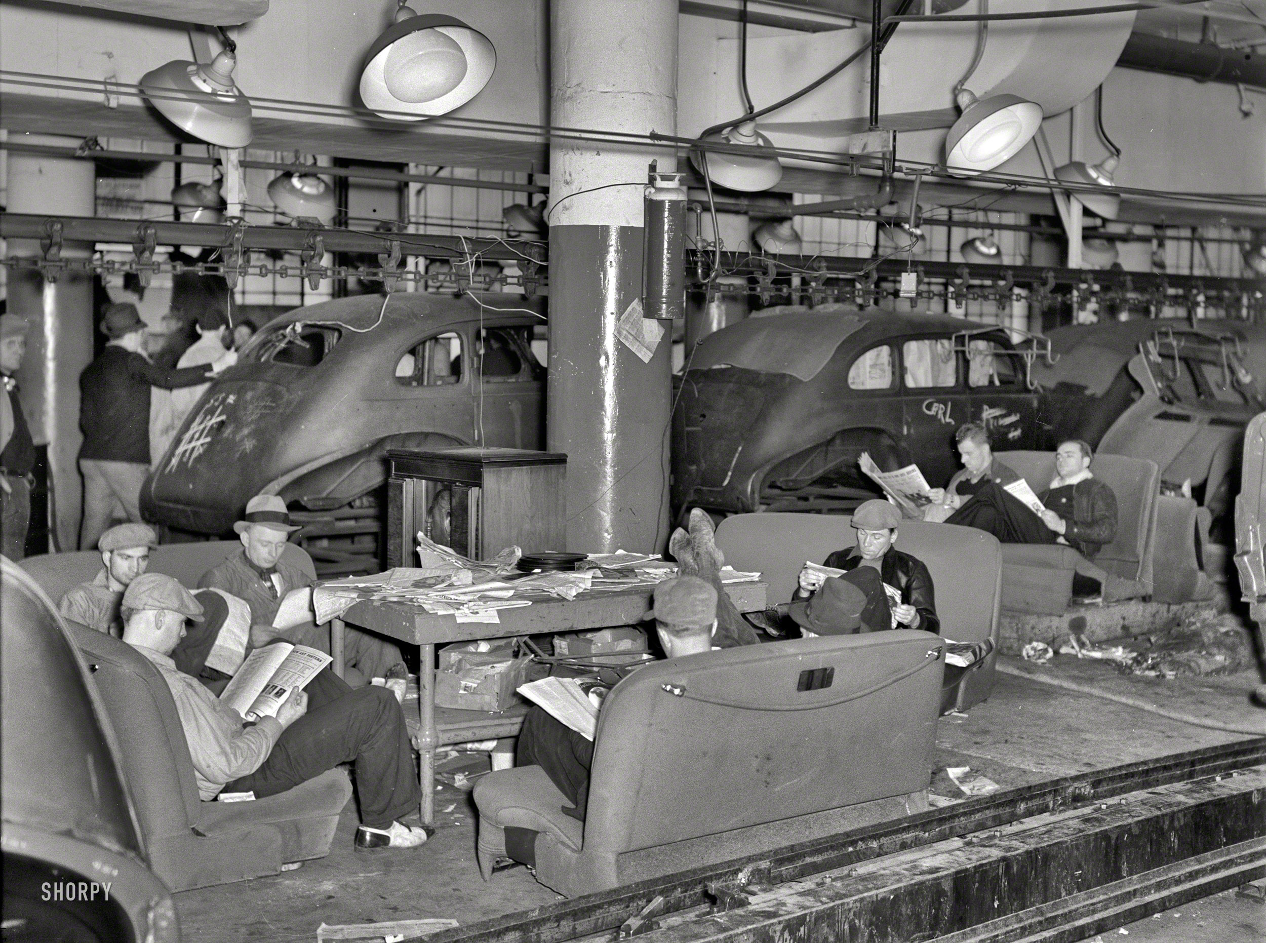 January 1937. Flint, Michigan. "Sit-down strikers. Fisher Body plant No. 3." The labor action that led to the unionization of the American auto industry. Note the "sleeping car" at right. Photo by Sheldon Dick. View full size.