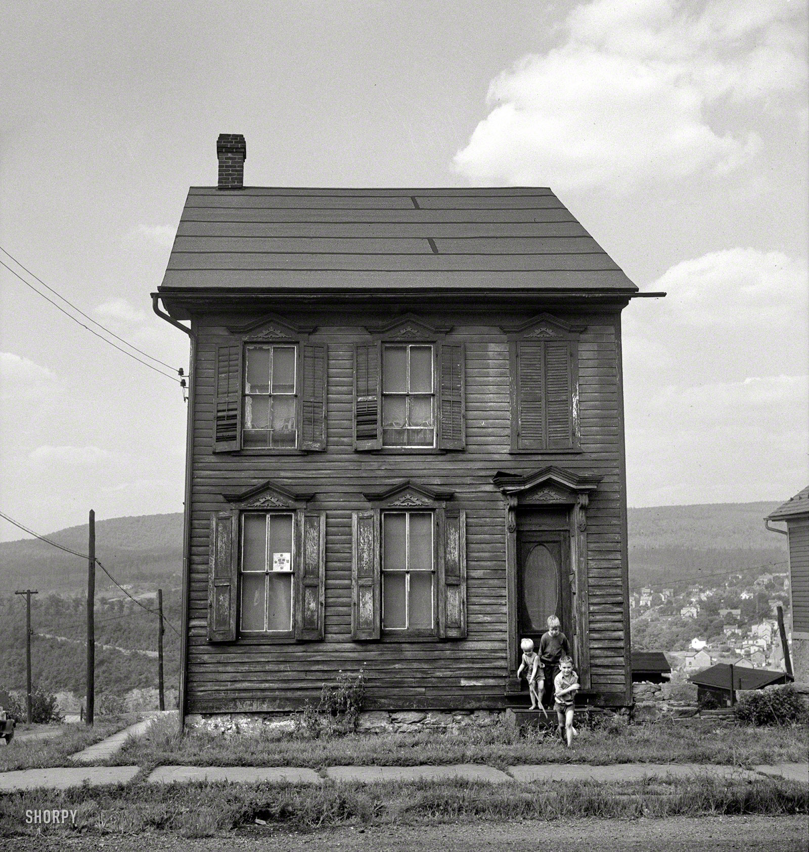August 1940. "Old house in Upper Mauch Chunk, Pennsylvania. In the background is East Mauch Chunk." Photo by Jack Delano. View full size.