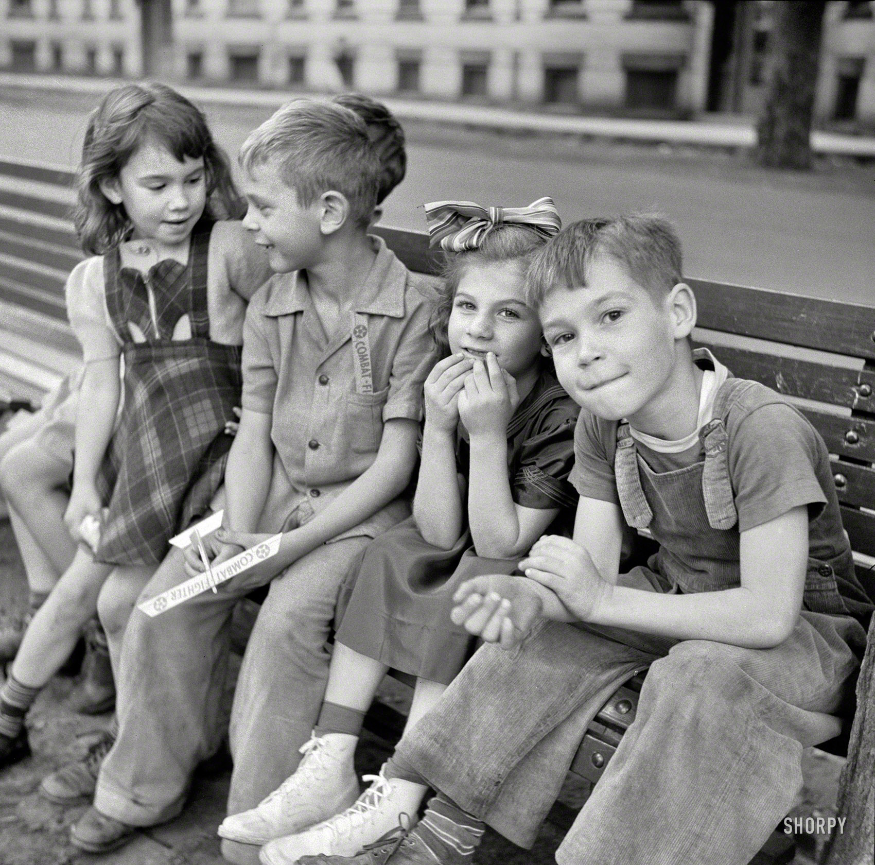 September 1941. "Millworkers' children. Holyoke, Massachusetts." Our fighter pilot again, and some more of his pals. Photo by John Collier. View full size.