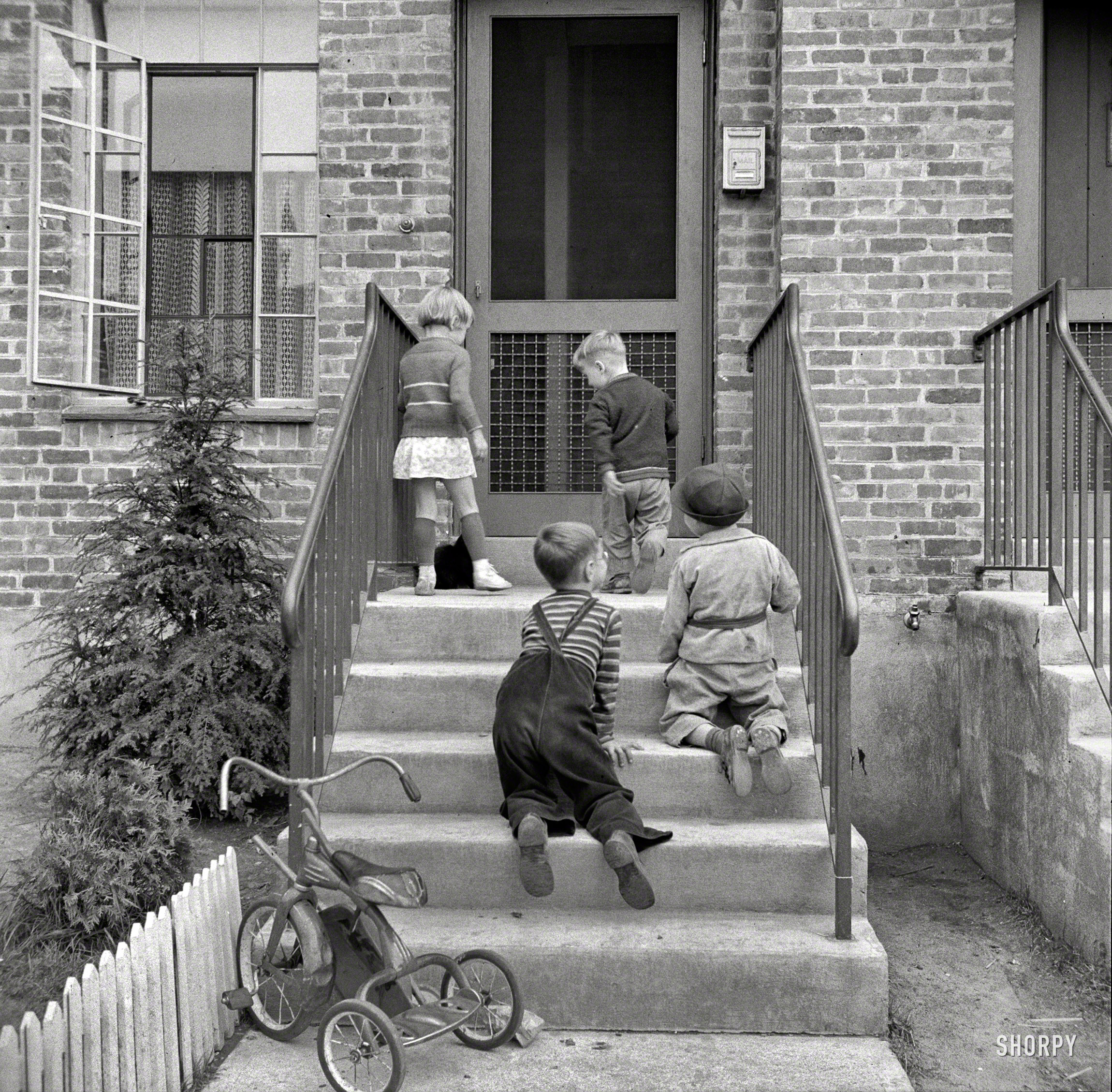 September 1941. "Children play in safety in the Federal Housing Administration low-income housing project at Holyoke, Massachusetts." Photo by John Collier for the Resettlement Administration. View full size.