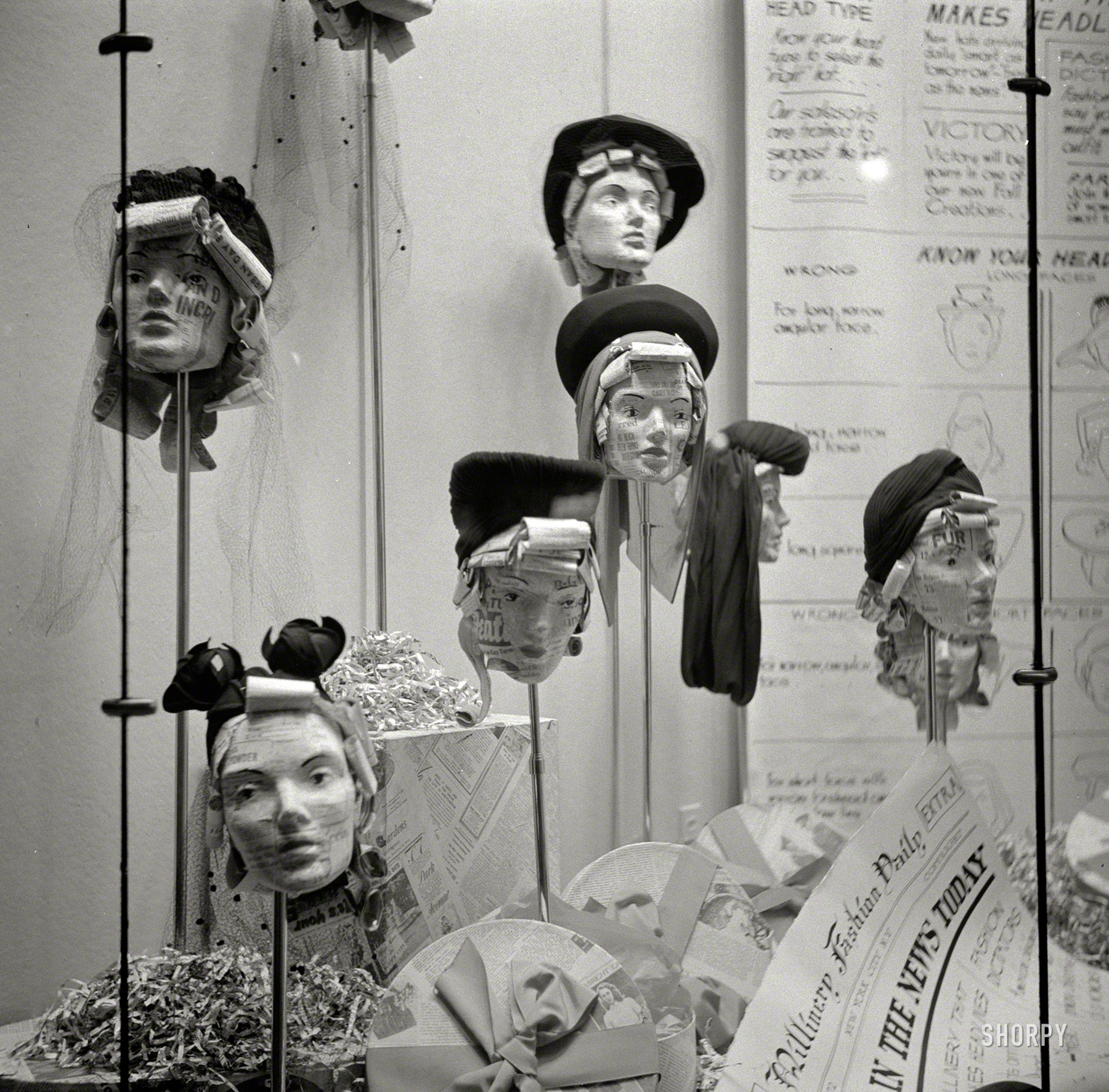 October 1941. "Manikins in store window. Amsterdam, New York." Faces in the News, and vice versa. Medium-format negative by John Collier. View full size.