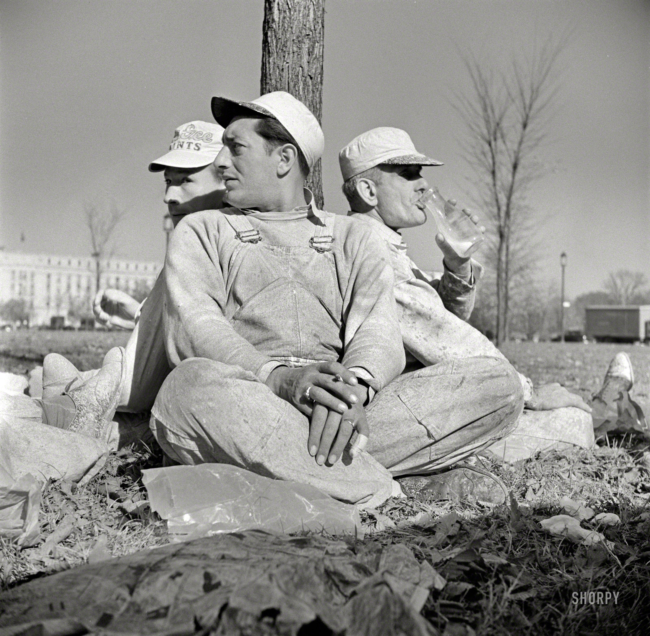 December 1941. "Workmen at lunch hour on emergency office space construction job. Washington, D.C." Period details: milk bottle, waxed paper, painters' caps. Medium-format nitrate negative by John Collier. View full size.