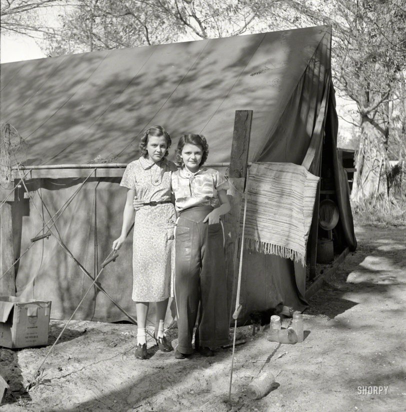 February 1939. "Migrant labor. Young packinghouse workers. Canal Point, Florida." Two of the thousands of young people who during the Great Depression found themselves picking or packing produce and living in a tent camp. Photo by Marion Post Wolcott for the Resettlement Administration. View full size.
