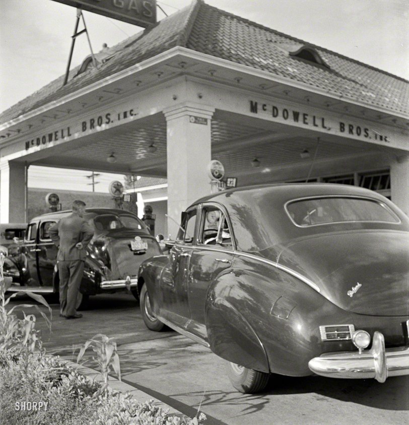 Washington, D.C. "At 7 a.m. on June 21, 1942, the day before stricter gas rationing was enforced, cars were pouring into this gas station on upper Wisconsin Avenue." If they still made cars that looked like this Packard, we'd run right out and buy one. Photo by Marjory Collins for the Office of War Information. View full size.
