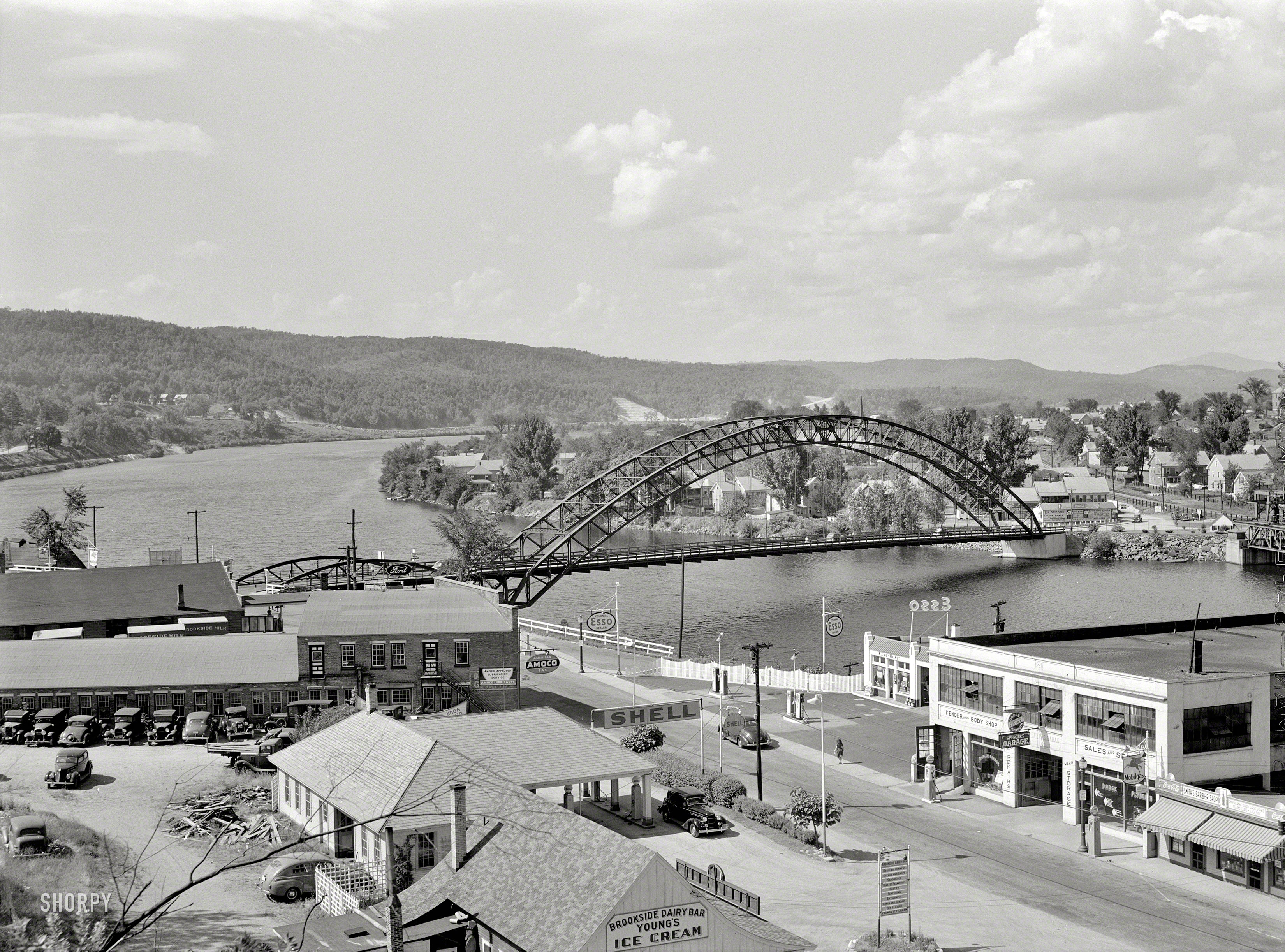 August 1941. "The Connecticut River at Bellows Falls, Vermont, and on the far side of the river, North Walpole, New Hampshire." Car Heaven. Medium-format negative by Jack Delano for the Office of War Information. View full size.