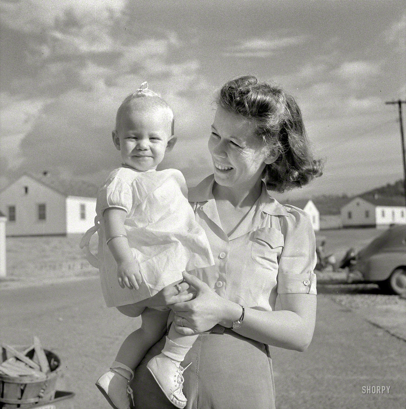 October 1941. Radford, Virginia. "Mrs. M.B. Henderson, wife of a defense worker, and their daughter, who live in Sunset Village FSA (Farm Security Administration) project." Photo by Marion Post Wolcott. View full size.