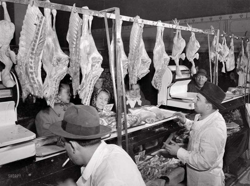 January 1943. "New York. Italian meat stall in the First Avenue market at Tenth Street." Medium-format safety negative by Marjory Collins. View full size.
