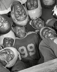 January 1943. Daytona Beach, Florida. "Bethune-Cookman College. Football is the favorite sport." Eleven Wildcats in an awesome team photo by Gordon Parks for the Office of War Information. 4x5 inch acetate negative. View full size.