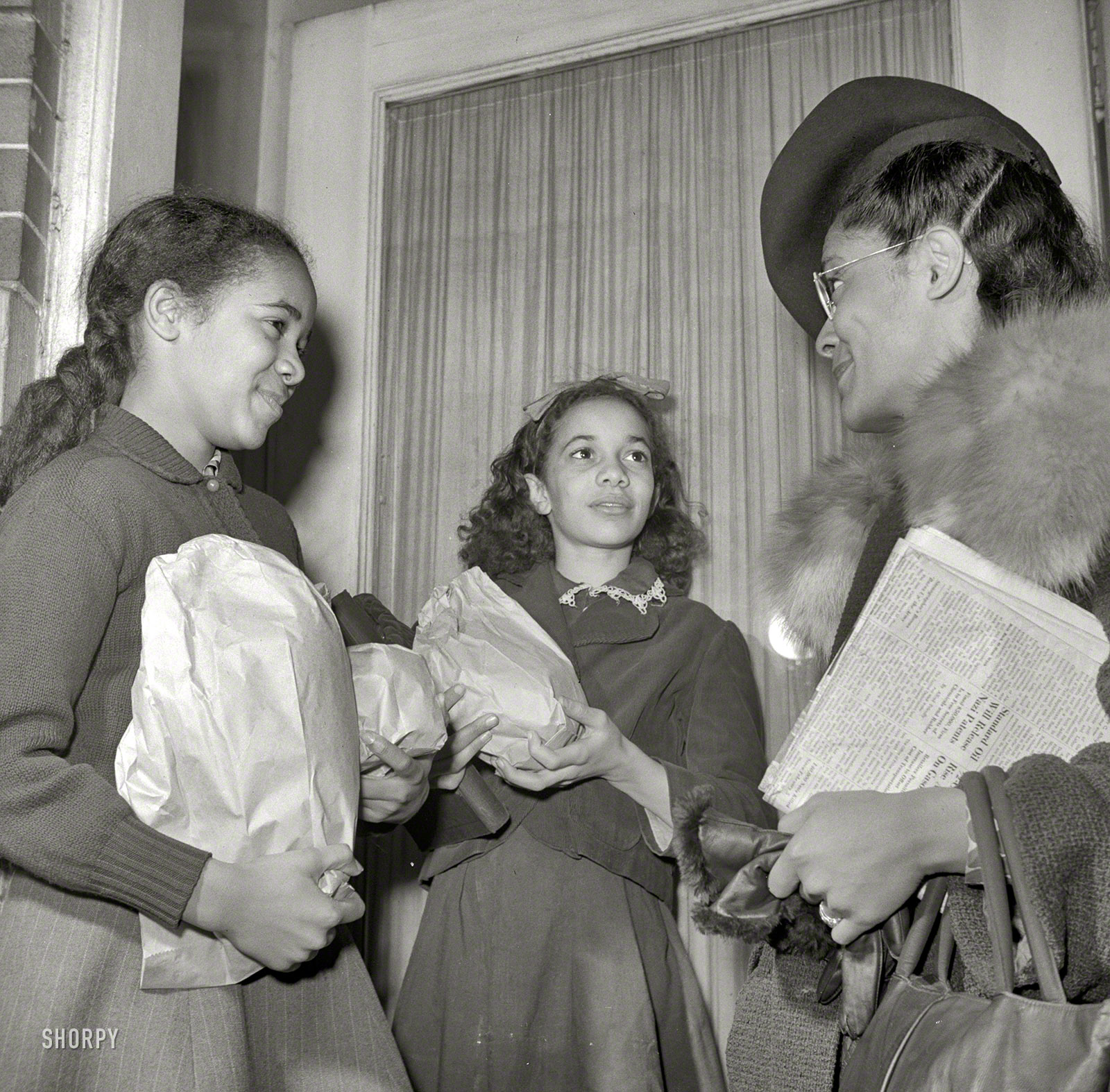 March 26, 1942. "Washington, D.C. Jewel Mazique, worker at the Library of Congress, coming home from work." Jewel, along with her doctor husband, are raising three of her nieces. Photo by John Collier for the OWI. View full size.