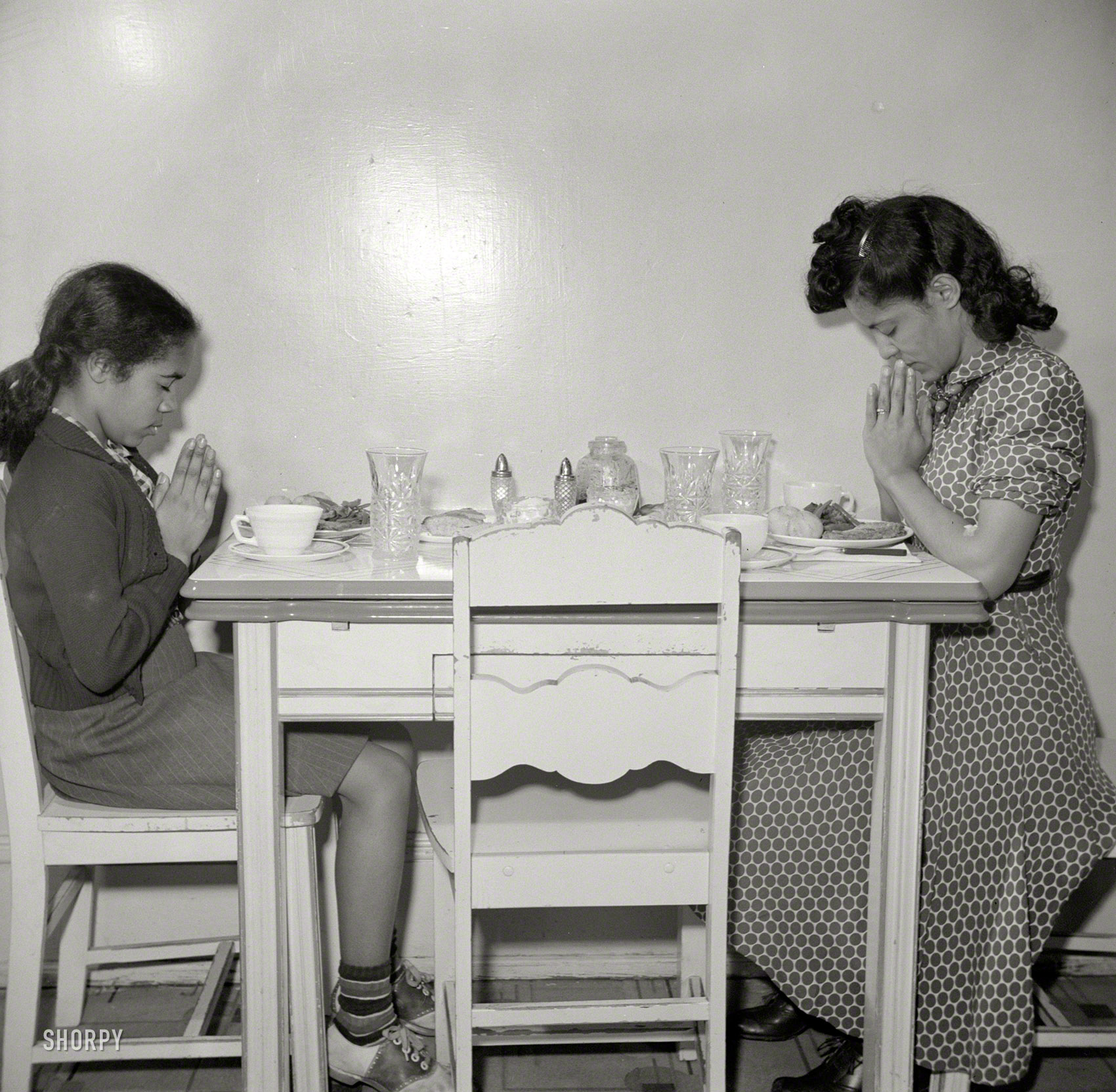 March 1942. Washington, D.C. "After a hard day's work in the Library of Congress, Jewel Mazique sits down to dinner with her niece." Medium-format negative by John Collier for the Office of War Information. View full size.