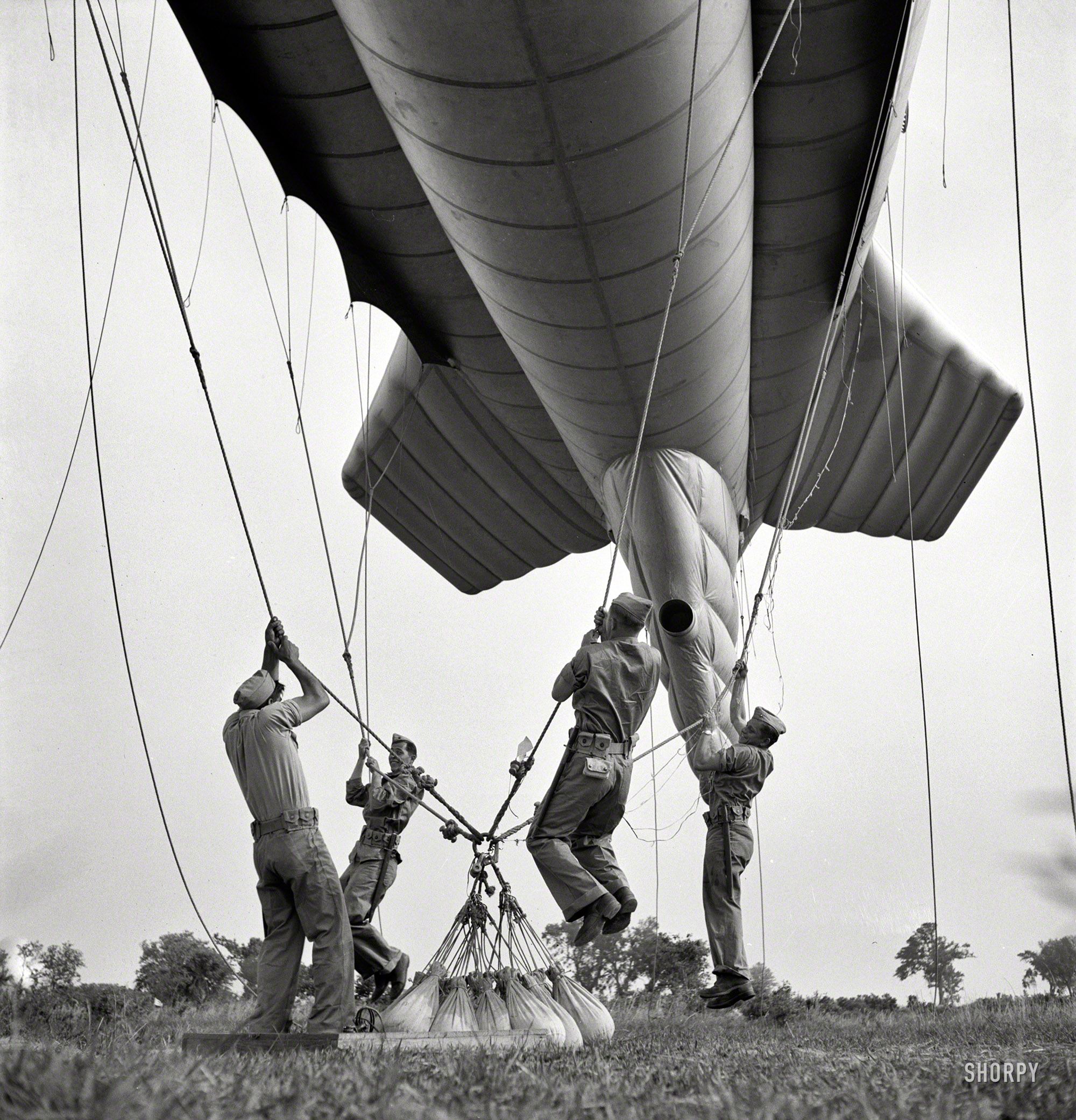 May 1942. Continuing the series last seen here. "Parris Island, South Carolina. Special Marine units learning how to bed down a big barrage balloon." Photos by Pat Terry and Alfred Palmer for the Office of War Information. View full size.