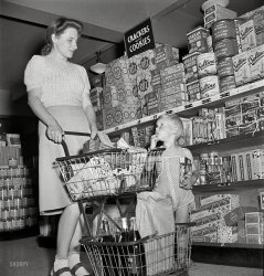 May 1942. "Greenbelt, Maryland. Federal housing project. Shopping in the cooperative grocery store." Do we have enough cookies? Medium-format nitrate negative by Marjory Collins for the Office of War Information. View full size.