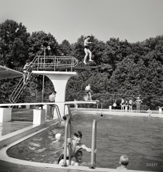 June 1942. Greenbelt, Maryland. "Swimming pool. Bathers pay admittance according to age. Season tickets are obtainable by families." Photo by Marjory Collins for the Resettlement Administration. View full size.