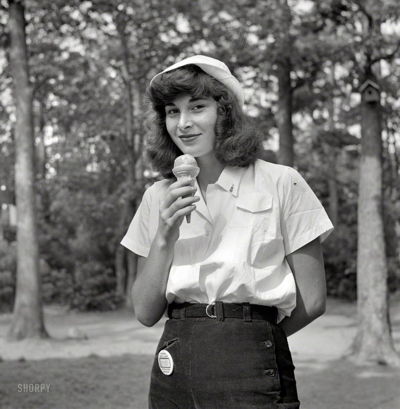 August 1942. "Interlochen, Michigan. National music camp where 300 or more young musicians study symphonic music for eight weeks each summer. A student eating an ice cream cone." Photo by Arthur Siegel. View full size.
