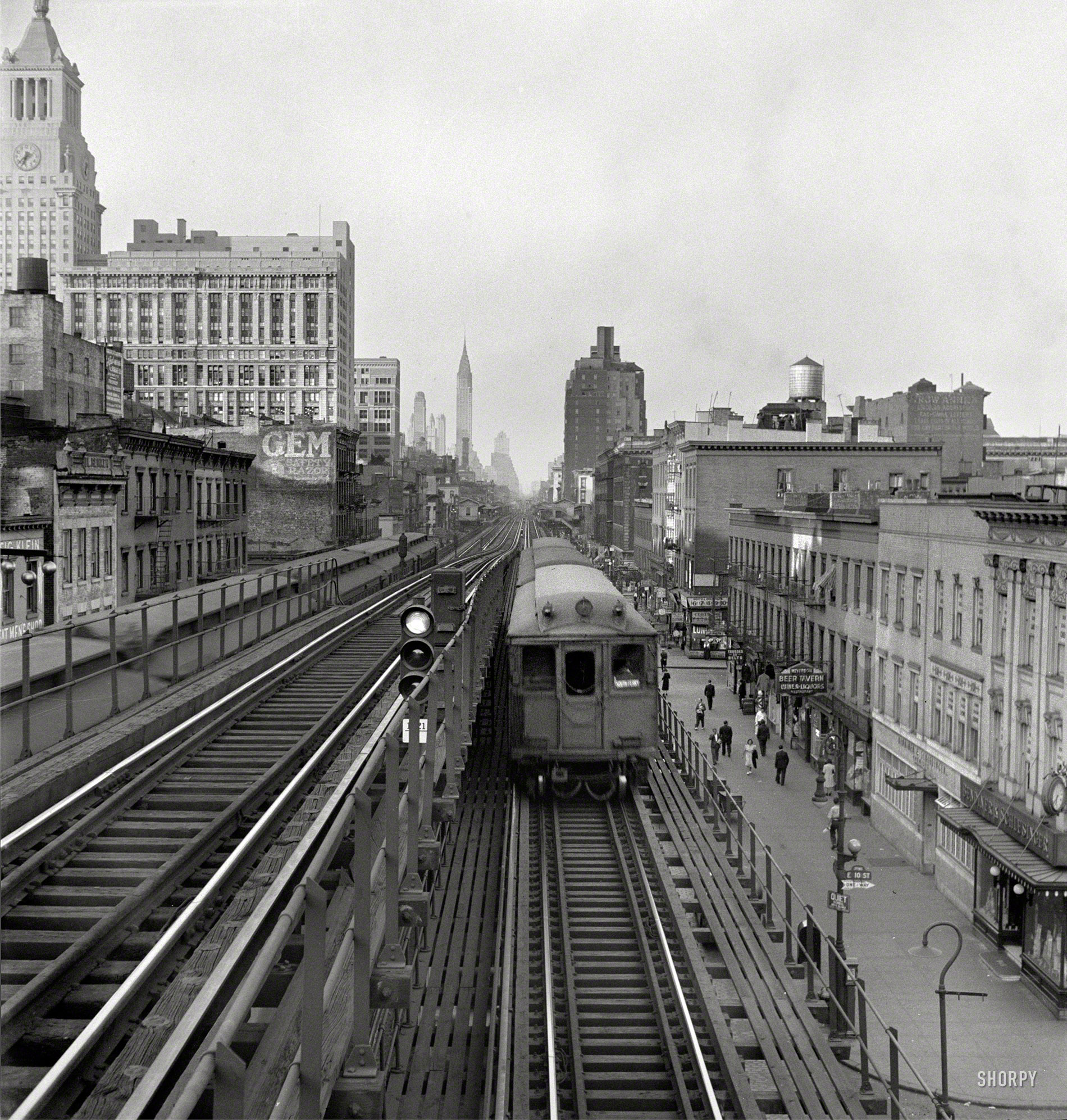 September 1942. "New York. Looking north from the Ninth Street station on the Third Avenue elevated railway as a train leaves on the local track." Medium format negative by Marjory Collins, Office of War Information. View full size.