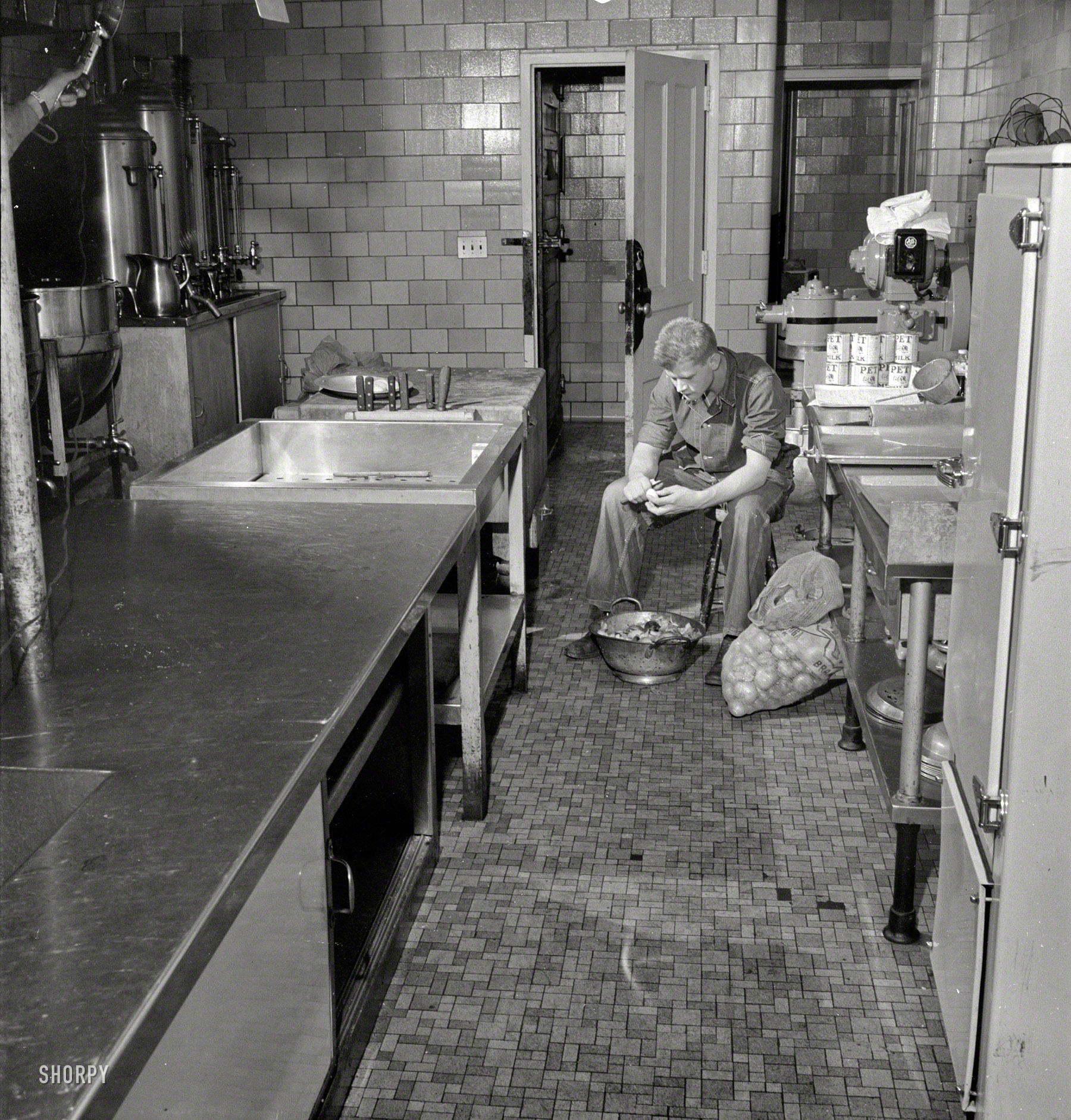 September 1942. Fort Belvoir, Va. "Army Sgt. George Camplair on kitchen police duty." Our first example of the more than 200 photos shot by Jack Delano documenting this soldier's induction, training and home life. View full size.