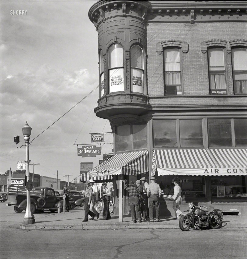 August 1942. "Dillon, Montana. Street corner. Dillon is the trading center for a prosperous cattle and sheep country." The cafe seen earlier here. Medium-format nitrate negative by Russell Lee for the Office of War Information. View full size.
